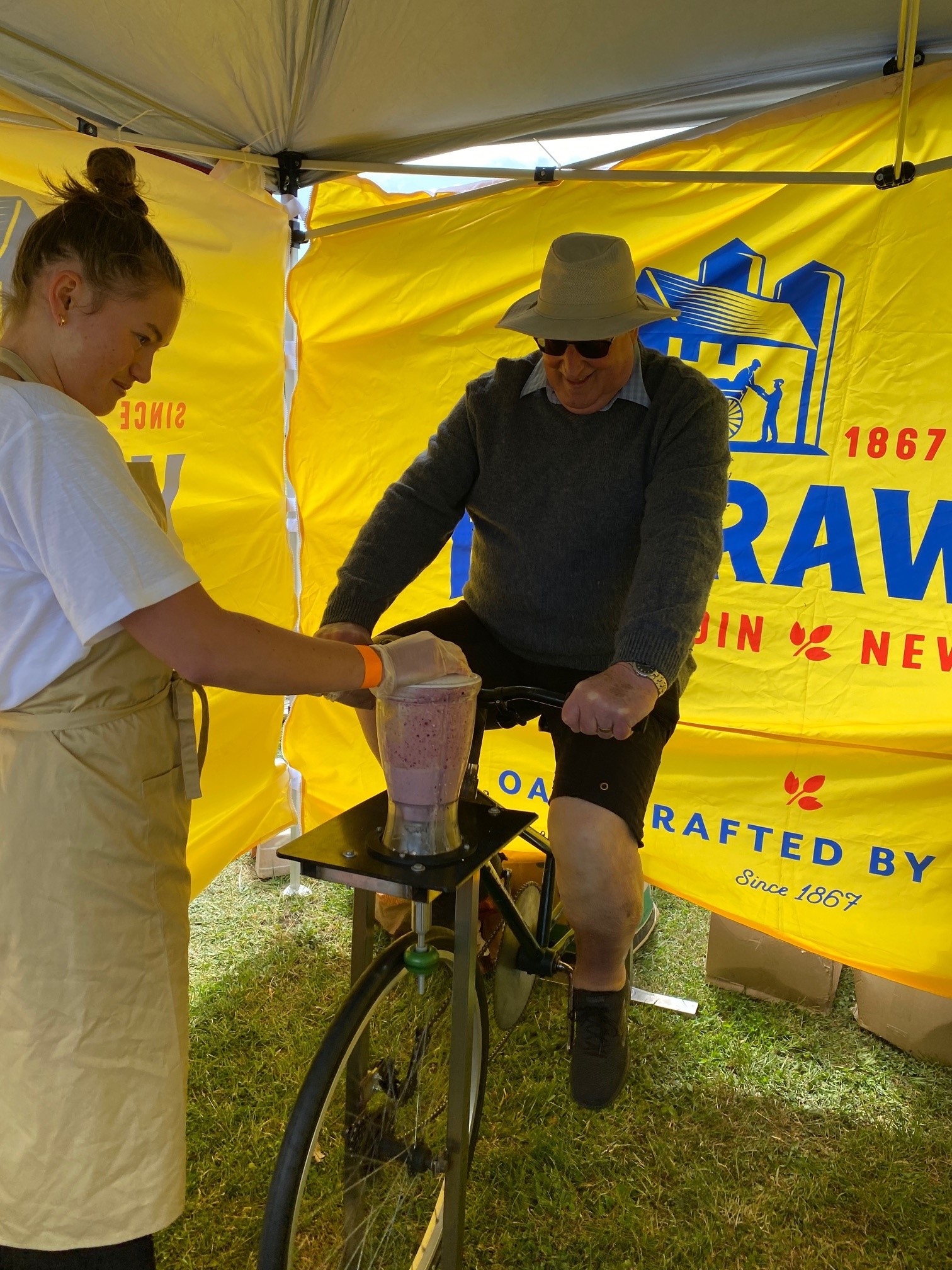 elderly man with hat on on smoothie bike