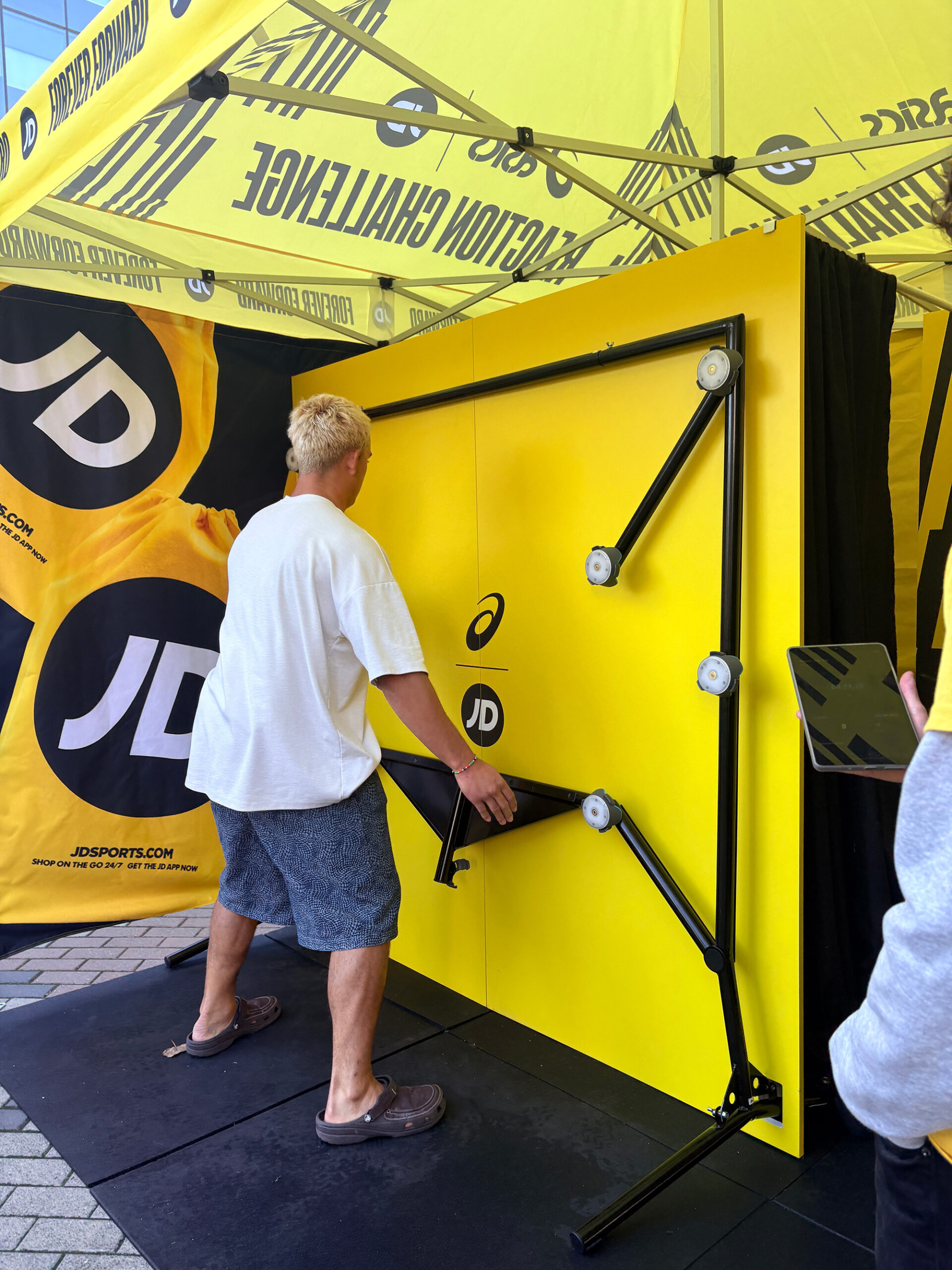 young man playing on activation timer wall